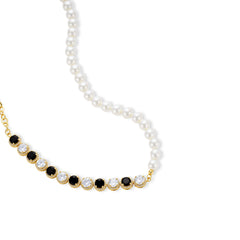 Gold-plated jewelry set with alternating black and clear cubic zirconia stones, featuring necklace, earrings and bracelet
