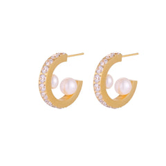 Gold pavé hoop earrings with two freshwater pearls nestled inside the curved design, featuring crystal-studded outer edge.