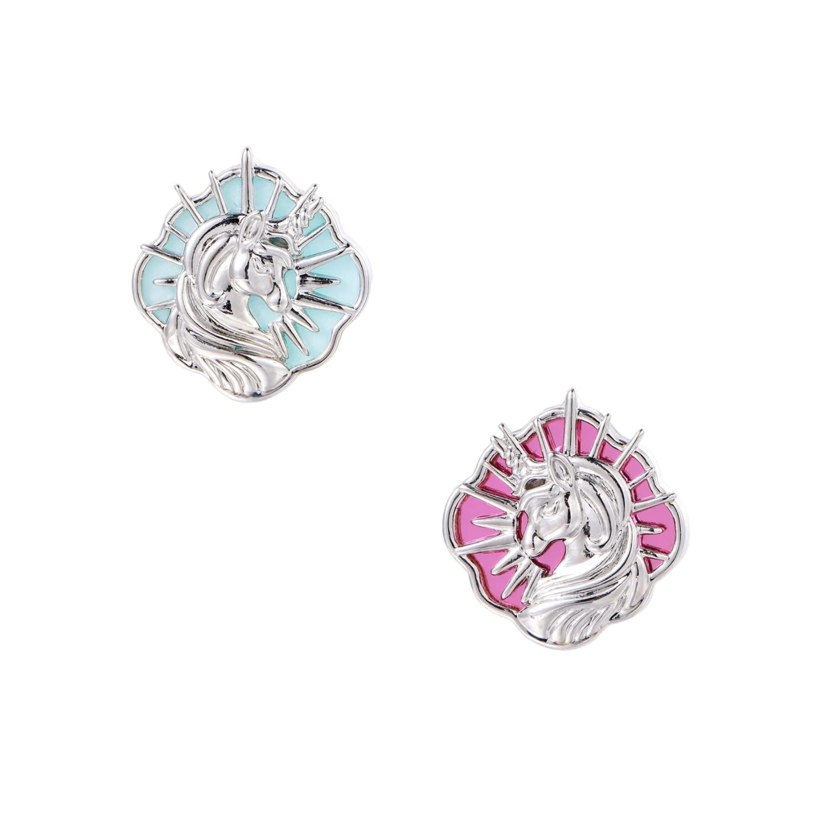 Silver unicorn stud earrings with pastel blue and pink enamel stones in sunburst prong settings on cream background