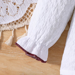 Weißes Mädchenkleid mit langen Ärmeln – Bluse mit Rüschenkragen und Zierborte, Cordrock mit großer Schleife und drei Knöpfen, eleganter Kinderrock