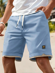 Lässige Herren-Sommershorts mit Taschen – Schwarz, elastischer Bund, Kordelzug, Polyester, zweilagiges Design, leicht und atmungsaktiv