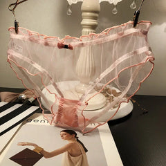 Sexy Damen-Slip, transparent, rosa, mit Schleife, Baumwollzwickel, atmungsaktiv, aus Mesh, mit Wellenkante und Lochmuster.