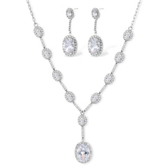 Elegant white gold plated jewelry set with oval cubic zirconia stones in halo settings, featuring Y-necklace and drop earrings.