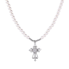 White pearl beaded necklace with ornate crystal-embellished cross pendant on white background, white gold plated finish