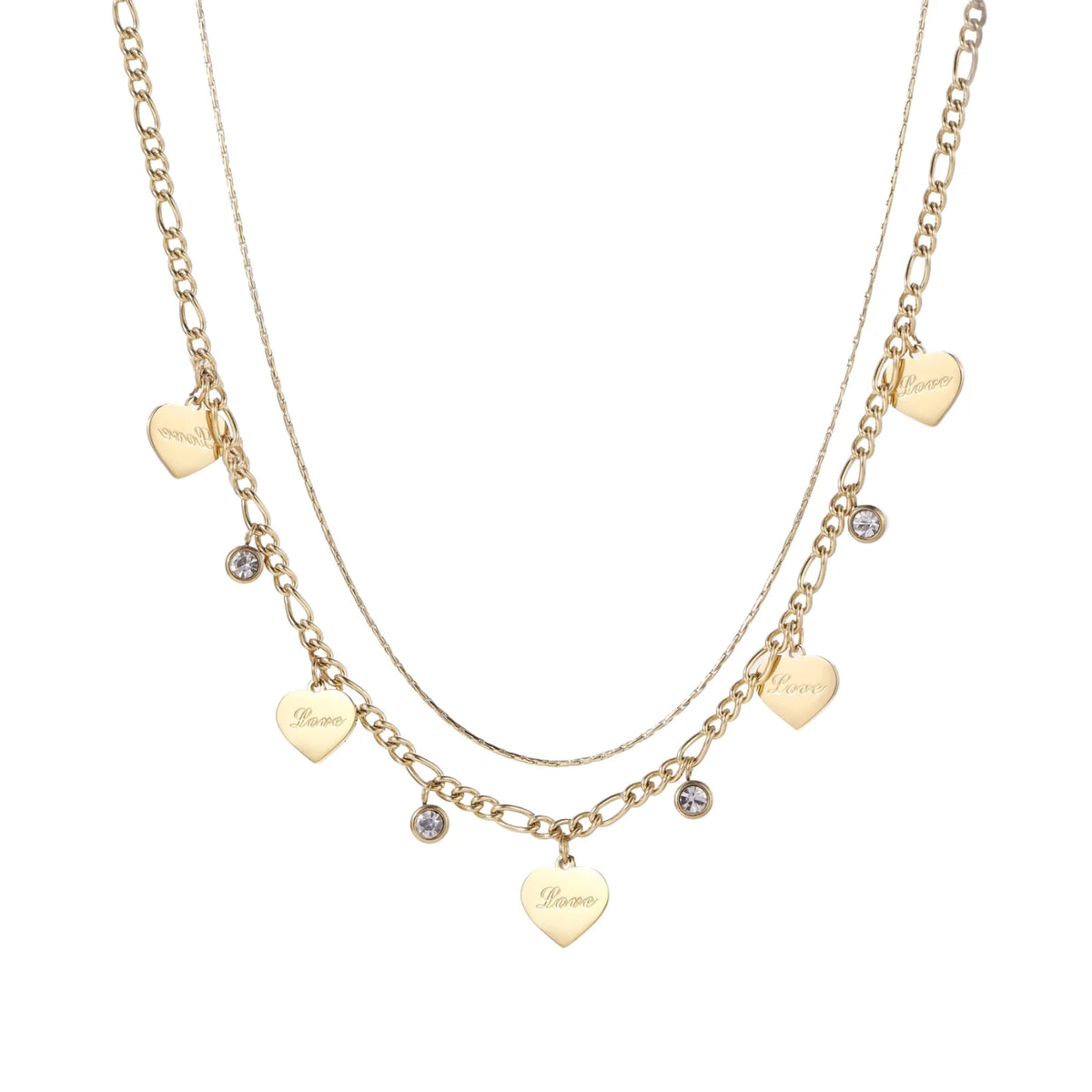 Gold layered necklace set with engraved heart pendants and crystal accents on cream background